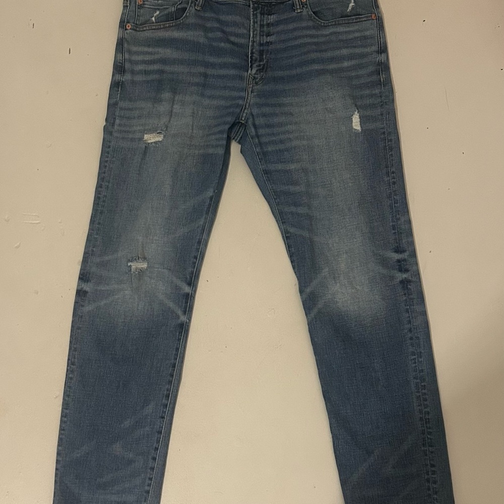 Distressed Blue Denim Jeans